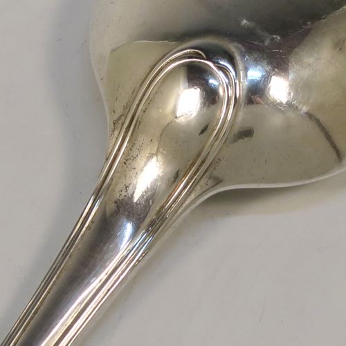A very handsome Antique Victorian Sterling Silver stuffing spoon in the double-struck Old English and Thread pattern. This elegant antique silver spoon was made by George Adams of London in 1848. The dimensions of this fine hand-made antique silver stuffing spoon are length 30.5 cms (12 inches), and it weighs approx. 150g (4.8 troy ounces).