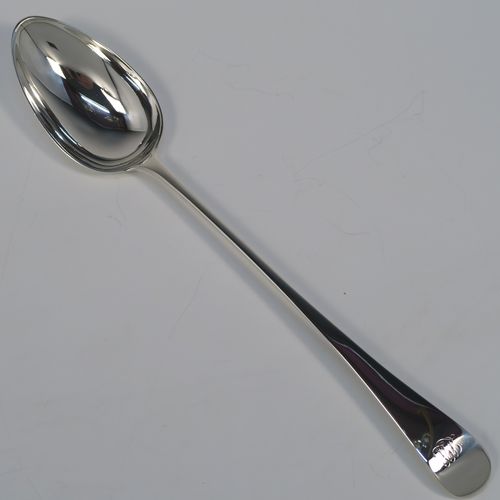 An elegant Antique Georgian Sterling Silver Old English pattern stuffing spoon, having a very plain handle with pip on reverse, and a plain oval bowl. This handsome antique silver serving spoon was made by Peter and Anne Bateman of London in 1794. The dimensions of this fine hand-made antique silver stuffing spoon are length 30.5 cms (12 inches), and it weighs approx. 110g (3.5 troy ounces). Please note that this item in monogrammed. 
