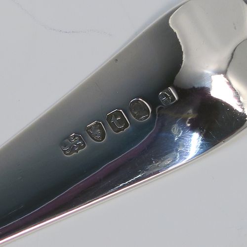 An elegant Antique Georgian Sterling Silver Old English pattern stuffing spoon, having a very plain handle with pip on reverse, and a plain oval bowl. This handsome antique silver serving spoon was made by Peter and Anne Bateman of London in 1794. The dimensions of this fine hand-made antique silver stuffing spoon are length 30.5 cms (12 inches), and it weighs approx. 110g (3.5 troy ounces). Please note that this item in monogrammed. 