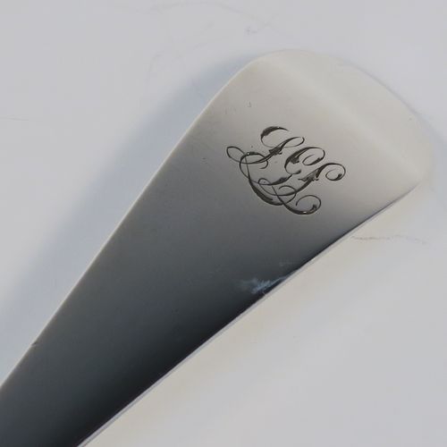 An elegant Antique Georgian Sterling Silver Old English pattern stuffing spoon, having a very plain handle with pip on reverse, and a plain oval bowl. This handsome antique silver serving spoon was made by Peter and Anne Bateman of London in 1794. The dimensions of this fine hand-made antique silver stuffing spoon are length 30.5 cms (12 inches), and it weighs approx. 110g (3.5 troy ounces). Please note that this item in monogrammed. 