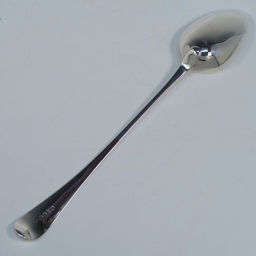 An elegant Antique Georgian Sterling Silver Old English pattern stuffing spoon, having a very plain handle with pip on reverse, and a plain oval bowl. This handsome antique silver serving spoon was made by Peter and Anne Bateman of London in 1794. The dimensions of this fine hand-made antique silver stuffing spoon are length 30.5 cms (12 inches), and it weighs approx. 110g (3.5 troy ounces). Please note that this item in monogrammed. 