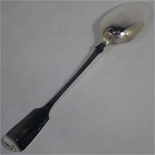 An Antique Georgian Sterling Silver heavy stuffing spoon in the Fiddle pattern, having a very plain handle with pip on reverse, and a plain oval bowl with shoulders above. Made by Clement Cheese of London in 1828. The dimensions of this fine hand-made antique silver stuffing spoon are length 30.5 cms (12 inches), and it weighs approx. 152g (4.9 troy ounces).