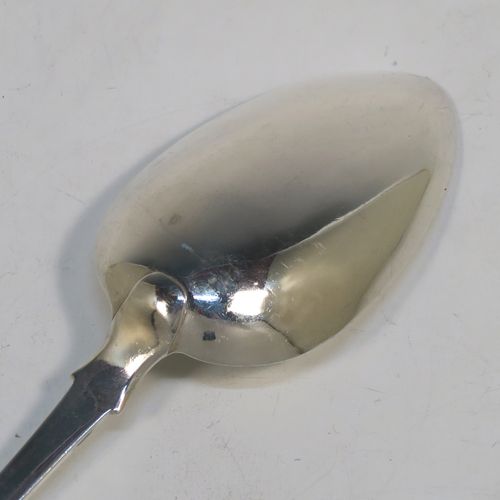 A handsome Antique early Victorian Sterling Silver Fiddle pattern stuffing spoon, having a very plain handle with pip on reverse, and a plain oval bowl with shoulders above. This elegant antique silver spoon was made by Charles Boyton I of London in 1837. The dimensions of this fine hand-made antique silver stuffing spoon are length 30 cms (11.75 inches), and it weighs approx. 96g (3 troy ounces).