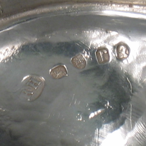 Antique Georgian sterling silver sugar basket, having an oval wire-work body, with hinged reeded swing-handle, a blue-glass liner, and sitting on a pedestal foot. Made by Robert Hennell I of London in 1792. The dimensions of this fine hand-made silver sugar basket are height (inc. handle) 18 cms (7 inches), length 15.5 cms (6 inches), and it weighs approx. 222g (7.2 troy ounces).