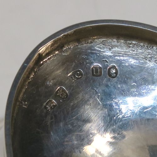 A very elegant and large Antique Georgian Sterling Silver sugar basket, having an oval body with tapering sides and hand-engraved neoclassical style decoration above two vacant cartouches on either side, with applied reeded borders, a hinged and reeded swing-handle, and sitting on a pedestal foot with matching decoration. This beautiful antique silver sweet-meat basket was made by Henry Chawner of London in 1795. The dimensions of this fine hand-made antique silver sugar basket are height (inc. handle) 18.5 cms (7.25 inches), length 16.5 cms (6.5 inches), and it weighs approx. 217g (7 troy ounces).