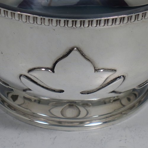 An Antique Sterling Silver sugar bowl, in a Georgian style, having a round bellied body, with unusual applied cut-card work and a gadroon border, two scroll side-handles, and all sitting on a pedestal foot. Made by Alexander Clarke & Co., of Birmingham 1913. The dimensions of this fine hand-made silver sugar bowl are height 7 cms (2.75 inches), spread across handles 15 cms (6 inches), and it weighs approx. 233g (7.5 troy ounces).    