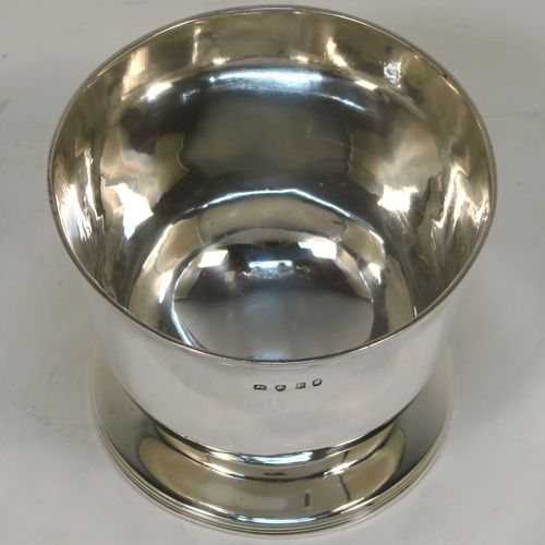 A handsome and rare Antique Georgian Sterling Silver sugar or sweetmeat bowl, having a plain round bellied body, with a hand-chased reeded border, and sitting on a pedestal foot. This elegant antique silver sugar bowl was made in London in 1800. The dimensions of this fine hand-made silver sweetmeat or sugar bowl are height 7.5 cms (3 inches), diameter 9 cms (3.5 inches), and it weighs approx. 167g (5.4 troy ounces).   