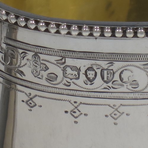 An Antique Victorian Sterling silver sugar and creamer set, having oval bodies with hand-engraved floral decoration, applied beaded borders, gold-gilt interiors, and angular handles. Made by Goldsmiths & Silversmiths of London in 1881. The dimensions of this fine hand-made antique silver cream and sugar set are height of creamer 9 cms (3.5 inches), length of sugar bowl 16 cms (6.25 inches), and with a total weight approx. 303g (9.8 troy ounces).