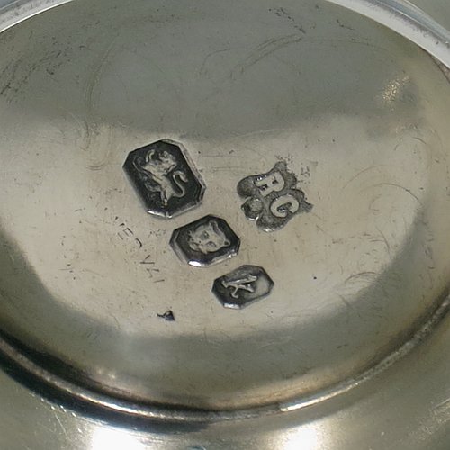 A Sterling Silver sugar and creamer set, having plain round bellied bodies, applied reeded borders, a sparrow-beak spout, and sitting on collet feet. Made by Robert Comyns of London in 1965. The dimensions of this fine hand-made silver sugar and creamer set are height of cream jug 7.5 cms (3 inches), diameter of bowl 9 cms (3.5 inches), and they weigh a total of approx. 225g (7.3 troy ounces).
