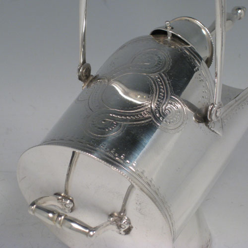 Antique Victorian silver plated hand-engraved sugar scuttle with original scoop, made in ca. 1890. Length 17 cms (6.75 inches), width 8 ms (3.25 inches), height (including handle) 18 cms (7 inches).