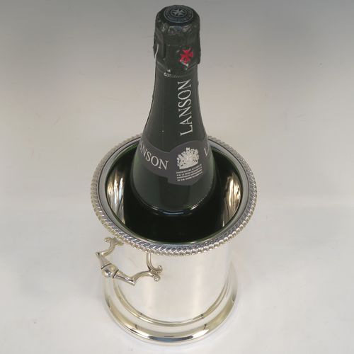 A very handsome Sterling Silver syphon stand, having a plain round body with straight sides, two cast scroll side-handles, an applied gadroon top border, and sitting on a collet foot. This elegant silver siphon stand was made by the Barker Brothers of Birmingham in 1932. The dimensions of this fine hand-made silver siphon stand are internal diameter 11.5 cms (4.5 inches), height 16 cms (6.3 inches), and it weighs approx. 616g (19.9 troy ounces).  
