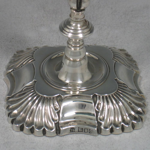 Antique Victorian sterling silver pair of tapersticks made by Thomas Bradbury of London in 1898. Height 14 cms.