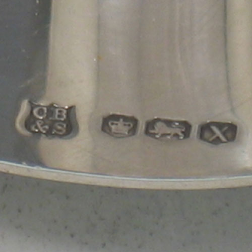 Pair of sterling silver 'Modernistic' tapersticks made by Cooper Brothers & Sons Ltd., of Sheffield in 1965. Length 12 cms, width 8 cms. Weight 6.5 troy ounces.