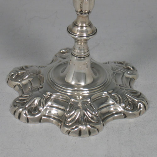    Antique Georgian cast sterling silver taper-stick made by John Cafe of London in 1754. Height 13 cms. Weight 6 troy ounces.