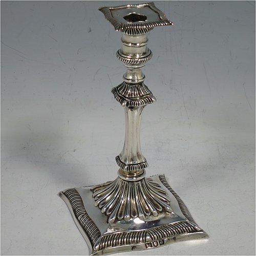 A very pretty Antique Victorian cast sterling silver taper-stick, having shaped gadroon borders, and hand-chased fluted decoration, with a removable nozzle. All made by Turner Bradbury of London in 1896. The dimensions of this fine hand-made antique silver taper-stick are height 12 cms (4.75 inches), and it weighs approx. 146g (4.7 troy ounces).  