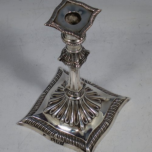 A very pretty Antique Victorian cast sterling silver taper-stick, having shaped gadroon borders, and hand-chased fluted decoration, with a removable nozzle. All made by Turner Bradbury of London in 1896. The dimensions of this fine hand-made antique silver taper-stick are height 12 cms (4.75 inches), and it weighs approx. 146g (4.7 troy ounces).