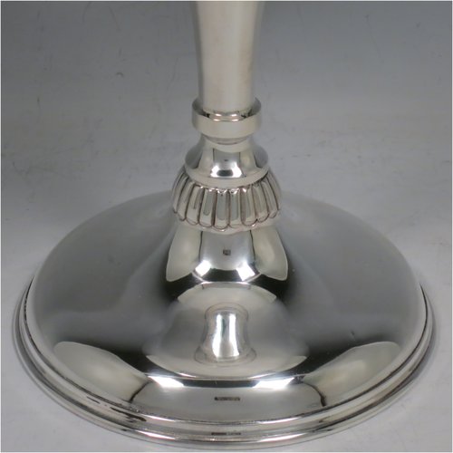 An Antique Edwardian Sterling Silver tazza dish, having a plain round bowl body, sitting on a pedestal foot with matching decoration and a small band of fluting. Made in Birmingham in 1909. The dimensions of this fine hand-made antique silver tazza dish are height 23 cms (9 inches), diameter 20 cms (8 inches), and it weighs approx. 435g (14 troy ounces).