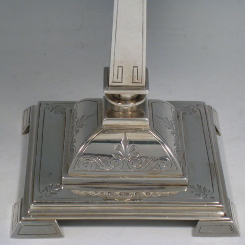 Antique Victorian sterling silver pair of tazzas, having round removable dishes, square-section tapering columns, and square pedestal feet, all hand-engraved with greek key and floral work. Made by Henry Wilkinson of Birmingham in 1870. Diameter of dishes21 cms (8.25 inches), height 21.5 cms (8.5 inches). Total weight approx. 1,277g (41.2 troy ounces).