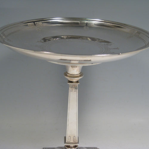 Antique Victorian sterling silver pair of tazzas, having round removable dishes, square-section tapering columns, and square pedestal feet, all hand-engraved with greek key and floral work. Made by Henry Wilkinson of Birmingham in 1870. Diameter of dishes21 cms (8.25 inches), height 21.5 cms (8.5 inches). Total weight approx. 1,277g (41.2 troy ounces).