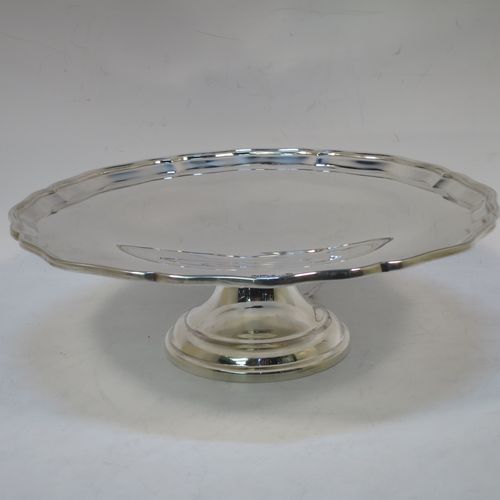 A handsome and heavy Sterling Silver tazza dish, having a round body with an applied and shaped reeded border, and sitting on a round stepped pedestal foot. Made by Z. Barraclough and Sons Ltd., of Sheffield in 1932. The dimensions of this fine hand-made silver tazza dish are height 8 cms (3 inches), diameter 25.5 cms (10 inches), and it weighs approx. 780g (25 troy ounces).