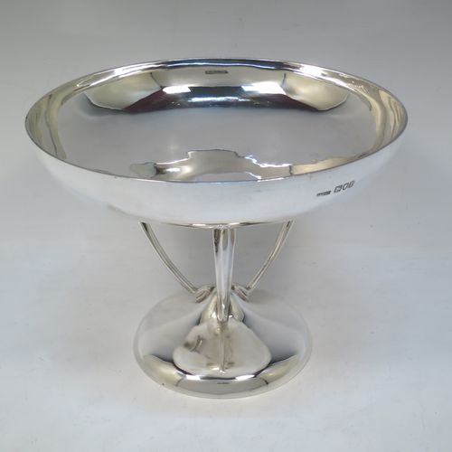 A pretty Art Nouveau style Antique Edwardian Sterling Silver tazza dish or bowl, having a plain round bowl body, sitting on a plain round pedestal foot with three scrolled supports. Made by Aspreys 
and Co. Ltd., of London in 1910. The dimensions of this fine hand-made antique silver tazza bowl or dish are height 17.5 cms (7 inches), diameter of bowl 23 cms (9 inches), and it weighs approx. 719g (23 troy ounces).   