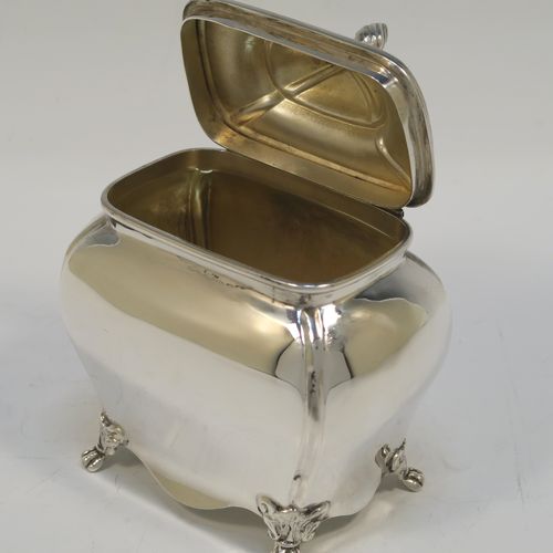 A very handsome Antique Sterling Silver tea caddy box in a Bon-bonier style, having a rectangular bellied body with hand-chased fluted corners, a hinged domed lid with a cast swirl finial, a gold-gilt interior, and all sitting on four cast lions-paw feet. This elegant antique silver tea caddy box was made by S. Blanckensee and Sons of Chester in 1921. The dimensions of this fine hand-made antique silver tea caddy box are height 11 cms (4.3 inches), depth 6.5 cms (2.6 inches), width 9.5 cms (3.75 inches), and it weighs approx. 186g (6 troy ounces).