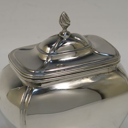A very handsome Antique Sterling Silver tea caddy box in a Bon-bonier style, having a rectangular bellied body with hand-chased fluted corners, a hinged domed lid with a cast swirl finial, a gold-gilt interior, and all sitting on four cast lions-paw feet. This elegant antique silver tea caddy box was made by S. Blanckensee and Sons of Chester in 1921. The dimensions of this fine hand-made antique silver tea caddy box are height 11 cms (4.3 inches), depth 6.5 cms (2.6 inches), width 9.5 cms (3.75 inches), and it weighs approx. 186g (6 troy ounces).