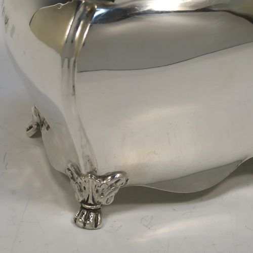 A very handsome Antique Sterling Silver tea caddy box in a Bon-bonier style, having a rectangular bellied body with hand-chased fluted corners, a hinged domed lid with a cast swirl finial, a gold-gilt interior, and all sitting on four cast lions-paw feet. This elegant antique silver tea caddy box was made by S. Blanckensee and Sons of Chester in 1921. The dimensions of this fine hand-made antique silver tea caddy box are height 11 cms (4.3 inches), depth 6.5 cms (2.6 inches), width 9.5 cms (3.75 inches), and it weighs approx. 186g (6 troy ounces).