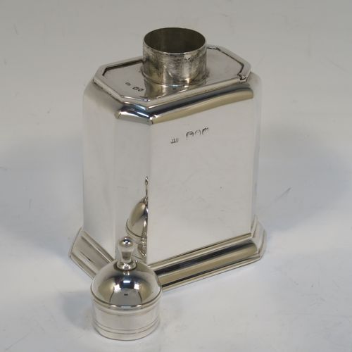 A very handsome Antique Victorian Sterling Silver tea caddy box, in an early Queen Anne style, having a straight-sided octagonal body, a slide out cover with round pull-off lid and finial (that doubles as a measure), and sitting on an octagonal collet foot. This elegant antique silver tea caddy box was made by George Unite of London in 1891. The dimensions of this fine hand-made silver tea caddy box are height 11 cms (4.3 inches), length 8 cms (3 inches), width 6 cms (2.3 inches), and it weighs approx. 155g (5 troy ounces).