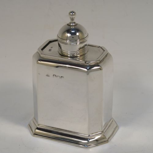 A very handsome Antique Victorian Sterling Silver tea caddy box, in an early Queen Anne style, having a straight-sided octagonal body, a slide out cover with round pull-off lid and finial (that doubles as a measure), and sitting on an octagonal collet foot. This elegant antique silver tea caddy box was made by George Unite of London in 1891. The dimensions of this fine hand-made silver tea caddy box are height 11 cms (4.3 inches), length 8 cms (3 inches), width 6 cms (2.3 inches), and it weighs approx. 155g (5 troy ounces).
