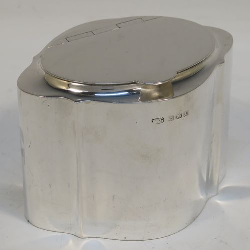 A very handsome Antique Sterling Silver tea caddy box, having a very plain shaped oval body with straight sides, an invisibly flat hinged plain lid with thumb-piece, a gold-gilt interior, and sitting on a flat base. This elegant antique silver tea caddy box was made by Levi and Salaman of Birmingham in 1919. The dimensions of this fine hand-made antique silver tea caddy box are height 7 cms (2.75 inches), length 9.5 cms (3.75 inches), depth 7 cms (2.75 inches), and it weighs approx. 143g (4.6 troy ounces).  