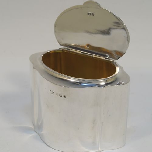 A very handsome Antique Sterling Silver tea caddy box, having a very plain shaped oval body with straight sides, an invisibly flat hinged plain lid with thumb-piece, a gold-gilt interior, and sitting on a flat base. This elegant antique silver tea caddy box was made by Levi and Salaman of Birmingham in 1919. The dimensions of this fine hand-made antique silver tea caddy box are height 7 cms (2.75 inches), length 9.5 cms (3.75 inches), depth 7 cms (2.75 inches), and it weighs approx. 143g (4.6 troy ounces).