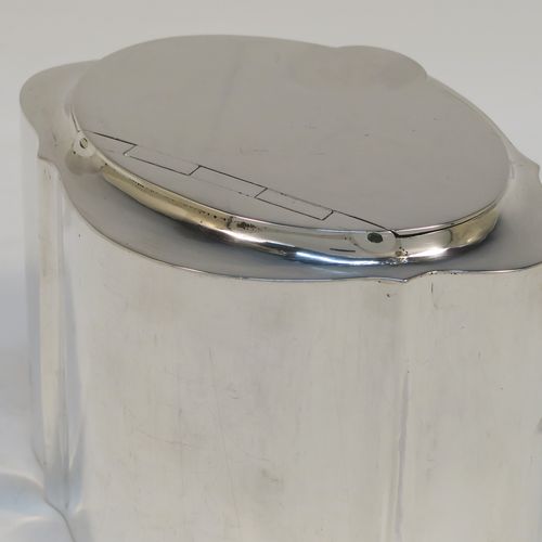 A very handsome Antique Sterling Silver tea caddy box, having a very plain shaped oval body with straight sides, an invisibly flat hinged plain lid with thumb-piece, a gold-gilt interior, and sitting on a flat base. This elegant antique silver tea caddy box was made by Levi and Salaman of Birmingham in 1919. The dimensions of this fine hand-made antique silver tea caddy box are height 7 cms (2.75 inches), length 9.5 cms (3.75 inches), depth 7 cms (2.75 inches), and it weighs approx. 143g (4.6 troy ounces).