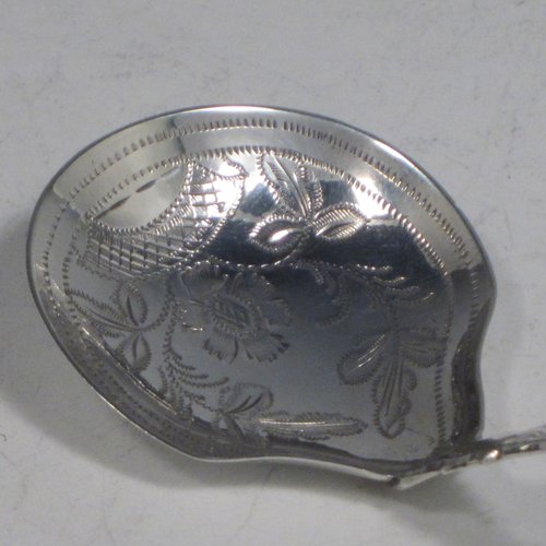 Antique Georgian sterling silver tea caddy spoon, having a hand-engraved handle, and an engraved round bowl, with floral decoration. Made by George Wintle of Birmingham in 1837. The dimensions of this fine hand-made silver tea caddy spoon are length 8.5 cms (3.3 inches), width 4 cms (1.5 inches), and it weighs approx. 11g (0.35 troy ounces).