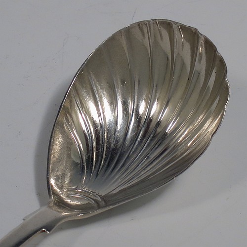 An Antique early Victorian Sterling Silver tea caddy spoon, having a plain Fiddle pattern handle, and a hand-chased fluted oval bowl. Made by William Elliott of London in 1843. The dimensions of this fine hand-made antique silver tea caddy spoon are length 10 cms (4 inches), width across bowl 3.5 cms (1.3 inches), and it weighs approx. 12g (0.38 troy ounces). Please note that this item is monogrammed.