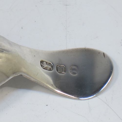 A very elegant Antique Georgian Sterling Silver tea caddy spoon, having an engraved curved handle, and a hand-chased shell style oval bowl. Made in London in 1788. The dimensions of this fine hand-made antique silver tea caddy spoon are length 7 cms (2.75 inches), width 3.5 cms (1.3 inches), and it weighs approx. 11g (0.4 troy ounces). Please note that this item is monogrammed.