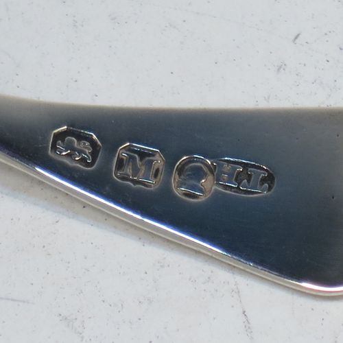 A very elegant Antique Georgian Sterling Silver tea caddy spoon, having a plain Old English pattern curved handle, and a hand-chased shell style shaped round bowl. Made by Thomas Hayter of London in 1807. The dimensions of this fine hand-made antique silver tea caddy spoon are length 8 cms (3.25 inches), width 4 cms (1.5 inches), and it weighs approx. 11g (0.4 troy ounces).