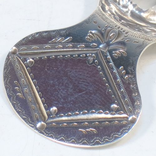 A very pretty Antique Georgian Sterling Silver tea caddy spoon, having an engraved flat handle, and a hand-chased shell style oval bowl. Made by Josiah Snatt of London in 1798. The dimensions of this fine hand-made antique silver tea caddy spoon are length 7 cms (2.75 inches), width 3.5 cms (1.3 inches), and it weighs approx. 9g (0.3 troy ounces).