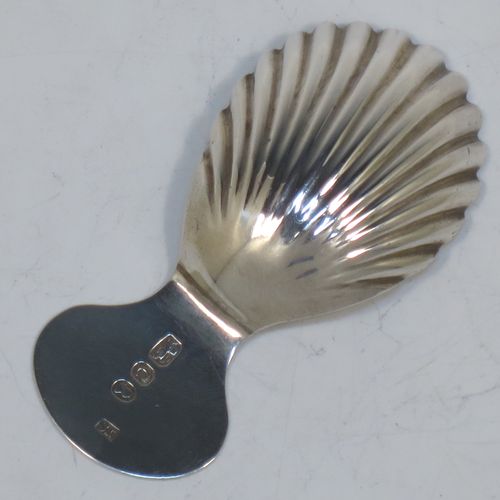 A very pretty Antique Georgian Sterling Silver tea caddy spoon, having an engraved flat handle, and a hand-chased shell style oval bowl. Made by Josiah Snatt of London in 1798. The dimensions of this fine hand-made antique silver tea caddy spoon are length 7 cms (2.75 inches), width 3.5 cms (1.3 inches), and it weighs approx. 9g (0.3 troy ounces).