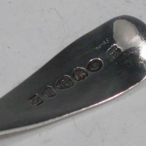 Antique Georgian sterling silver tea caddy spoon, having an engraved curved handle, and a fluted / scalloped bowl. Made by Reid and Sons of Newcastle in 1803. The dimensions of this fine hand-made silver tea caddy spoon are length 10 cms (4 inches), width 3.5 cms (1.3 inches), and it weighs approx. 14g (0.5 troy ounces).