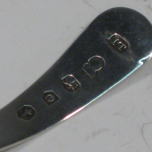 Antique Georgian sterling silver tea caddy spoon, having an engraved curved handle, and an engraved and bowl, with floral decoration. Made by Joseph Taylor of Birmingham in 1802. The dimensions of this fine hand-made silver tea caddy spoon are length 8 cms (3 inches), width 3.5 cms (1.3 inches), and it weighs approx. 6g (0.2 troy ounces).