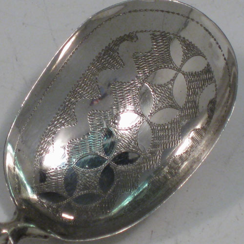 Antique Georgian sterling silver tea caddy spoon, having an engraved Fiddle pattern handle, and an engraved bowl, with a geometrical floral decoration. Made by Joseph Taylor of Birmingham in 1825. The dimensions of this fine hand-made silver tea caddy spoon are length 7.5 cms (3 inches), width 3 cms (1.2 inches), and it weighs approx. 6g (0.2 troy ounces).