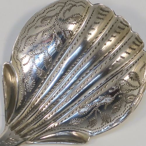A very pretty Antique Victorian Sterling Silver tea caddy spoon, having a hand-engraved floral and stipple decoration, and a hand-chased shell style bowl. This elegant antique silver tea caddy spoon was made by James Collins of Birmingham in 1845. The dimensions of this fine hand-made antique silver tea caddy spoon are length 8.5 cms (3.3 inches), width 4 cms (1.5 inches), and it weighs approx. 6g (0.2 troy ounces).