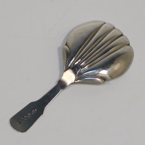 A very pretty Antique Victorian Sterling Silver tea caddy spoon, having a hand-engraved floral and stipple decoration, and a hand-chased shell style bowl. This elegant antique silver tea caddy spoon was made by James Collins of Birmingham in 1845. The dimensions of this fine hand-made antique silver tea caddy spoon are length 8.5 cms (3.3 inches), width 4 cms (1.5 inches), and it weighs approx. 6g (0.2 troy ounces).