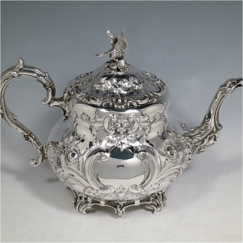 An Antique Victorian Sterling Silver four-piece tea and coffee set, having round baluster bodies with hand-chased floral decoration, with silver insulated handles, cast eagle finials, eagle face spouts, the sugar bowl and cream jug with gold-gilt interiors, and all sitting on cast and hand-pierced feet. All made by Martin & Hall, with the teapot & cream jug from London in 1870, the coffee pot from Sheffield in 1890, and the sugar bowl from Sheffield in 1896. The dimensions of this fine hand-made silver tea and coffee service are length of teapot 27 cms (10.6 inches), height of coffee pot 26 cms (10.25 inches), and the total weight is approx. 2,253g (73 troy ounces).