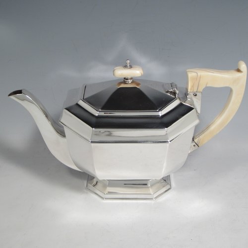 Sterling silver Art Deco tea and coffee service, consisting of Teapot, Coffee pot, sugar bowl, cream jug, and tea tray. Having plain octagonal bodies, with bone handles and finials, and sitting on pedestal feet, displayed on an original octagonal tea tray with matching handles. All made by Emile Viner of Sheffield in 1938. The dimensions of this fine hand-made silver tea and coffee service are length of tray 53.5 cms (21 inches), width 12.75 inches (32.5 cms), height of coffee pot 20 cms (8 inches), and with a total weight of approx. 3,500g (113 troy ounces).