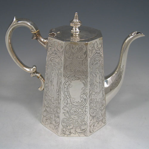 A beautiful Antique Victorian Sterling Silver four-piece tea and coffee service, consisting of a coffee pot, tea pot, sugar bowl, and cream jug, having octagonal panelled bodies with hand-engraved floral and scroll decoration, hinged lids with finials, and insulated silver handles, and gold-gilt interiors to the cream jug and sugar bowl. This impressive antique silver tea and coffee service was made by Hayne and Cater of London in 1848. The dimensions of this fine hand-made silver set are height of coffee pot 22 cms (8.75 inches), length of teapot 23 cms (9 inches), and with a total weight of approx. 1,967g (63.5 troy ounces).