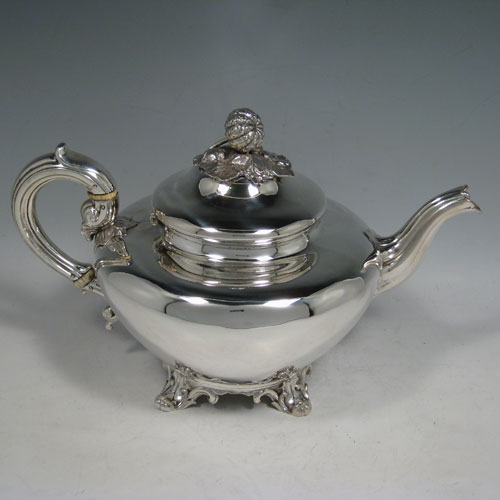   Antique Victorian sterling silver four-piece tea and coffee service, consisting of a coffee pot, tea pot, sugar bowl, and cream jug, having plain round baluster, hinged lids with floral finials, and insulated silver handles, and sitting on four floral feet. Made by the Savory Brothers of London between 1848 and 1854. Height of coffee pot 25.5 cms (10 inches), length of teapot 29 cms (11.5 inches). Total weight approx. 2,138g (70 troy ounces).
