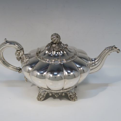 A beautiful Antique Victorian Sterling Silver four-piece tea and coffee service, in the Melon fluted style, having round hand-chased bodies, hinged lids with cast floral finials, insulated silver scroll handles, gold-gilt interiors, and all sitting on cast shell and scroll feet. This fantastic silver tea and coffee service was made by the Barnard Brothers of London in 1835/1836. The dimensions of this fine hand-made antique silver tea and coffee set are height of coffee pot 25.5 cms (10 inches), length of teapot 30.5 cms (10 inches), and with a total weight of approx. 2,232g (72 troy ounces).