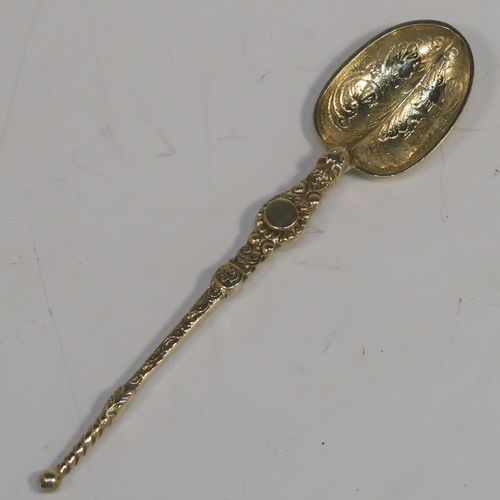 A beautiful set of twelve Antique Victorian Sterling Silver and gold-gilt coffee spoons, in the Coronation Anointing pattern with hand-engraved floral decoration to the bowls, and cast ornate handles, all in their original cream satin and maroon velvet-lined presentation box. These pretty antique silver and gold-gilt coffee spoons were made by Wakely and Wheeler of London in 1901. The dimensions of this fine hand-made antique silver set of coffee spoons are length of each spoon 10.5 cms (4.25 inches), and the total weight is approx. 135g (4.4 troy ounce).
